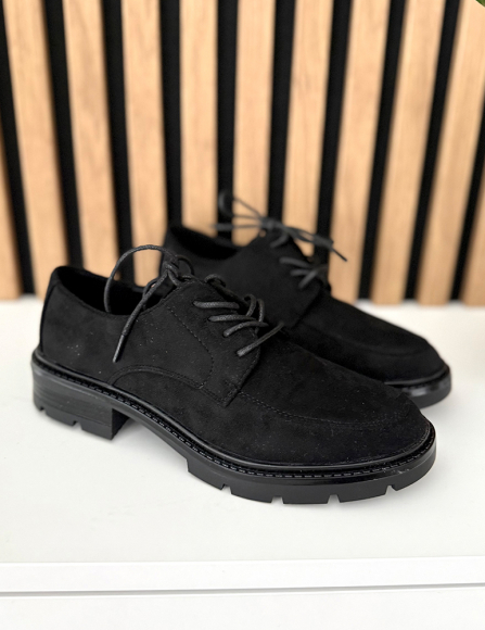 Čierne poltopánky Irana