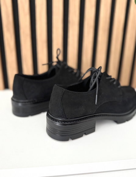 Čierne poltopánky Irana